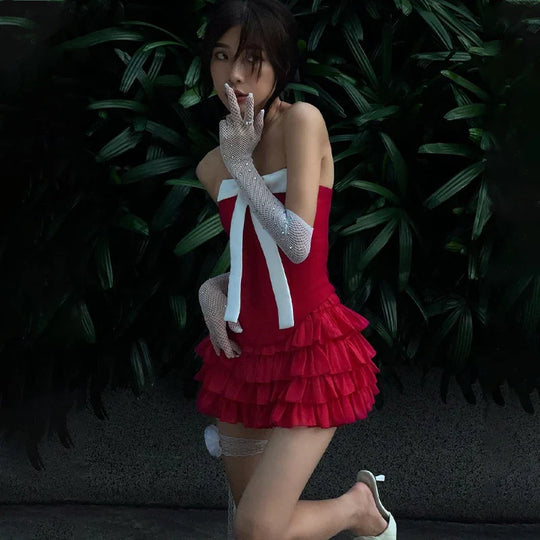 Schattige cocktailjurk met ruffles en grote strik