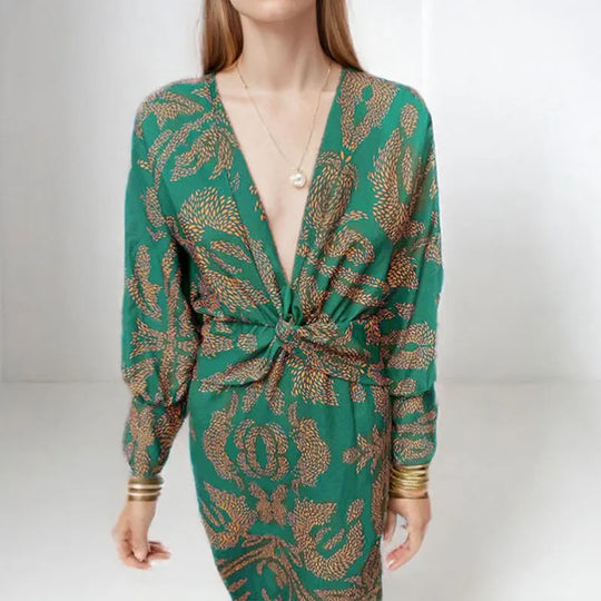 Dames midi jurk met een wikkeldecolleté en een bloemenpatroon