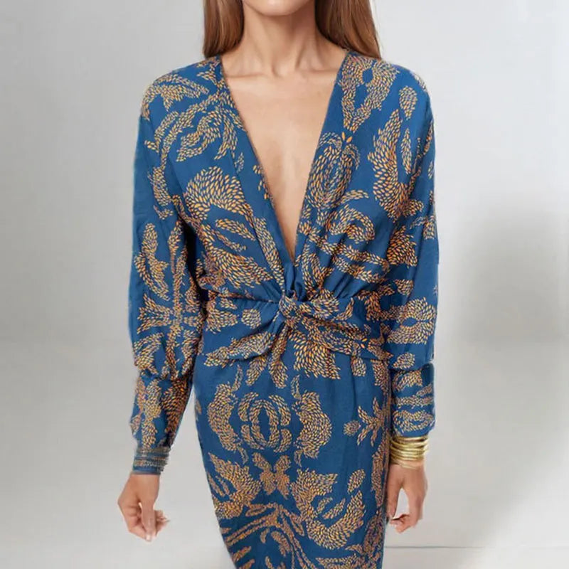 Dames midi jurk met een wikkeldecolleté en een bloemenpatroon