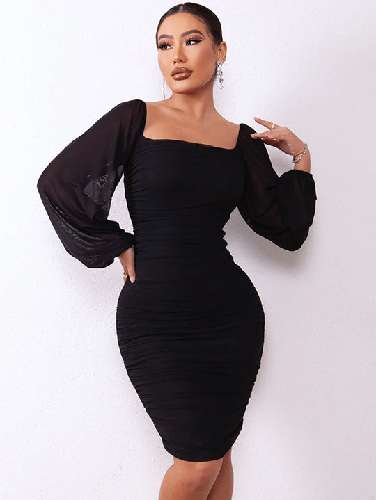 Elegant pencil dress with pleats and puff sleeves