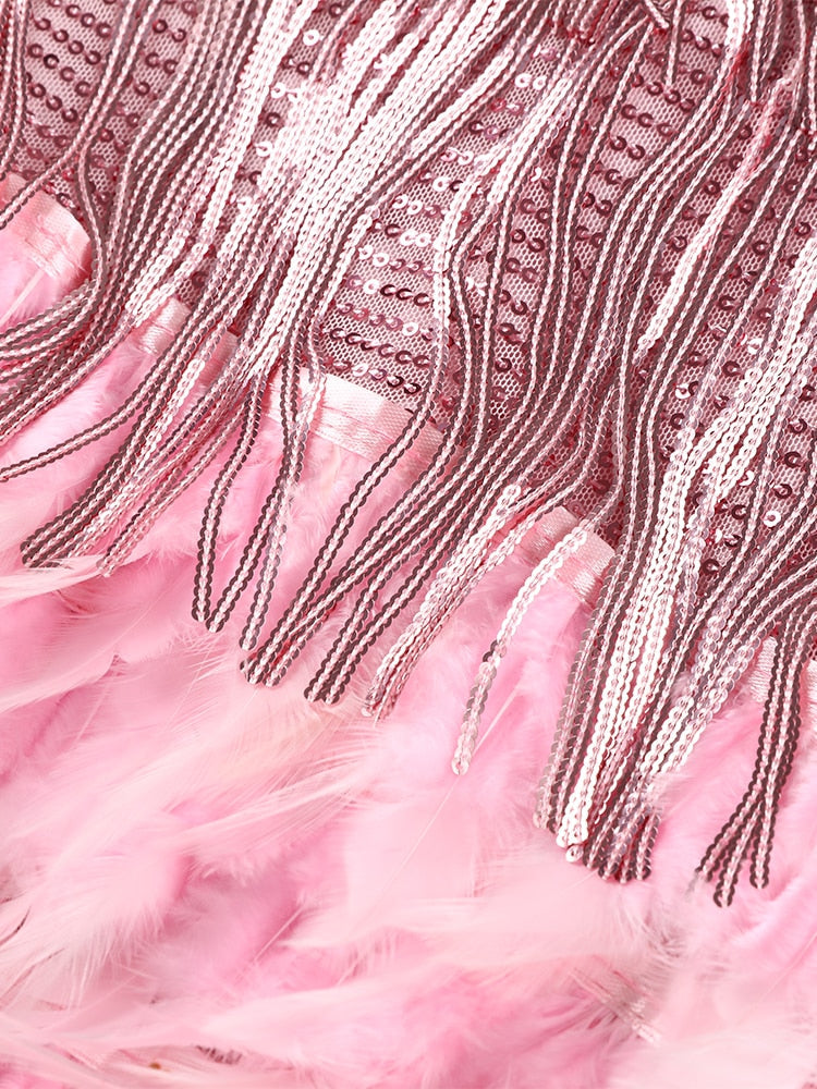 Avondjurk met franjes en veren op spaghettibandjes