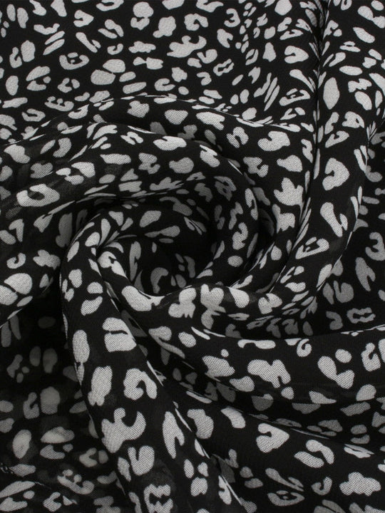 Luchtige Midi-Jurk met V-hals en Subtiele Bloemenprint