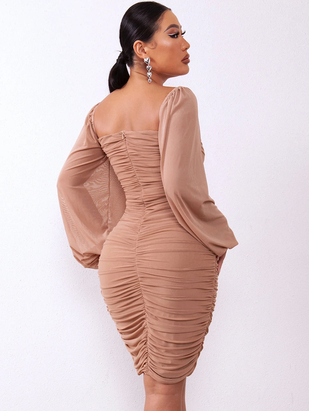 Elegant pencil dress with pleats and puff sleeves