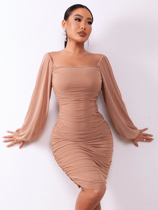 Elegant pencil dress with pleats and puff sleeves